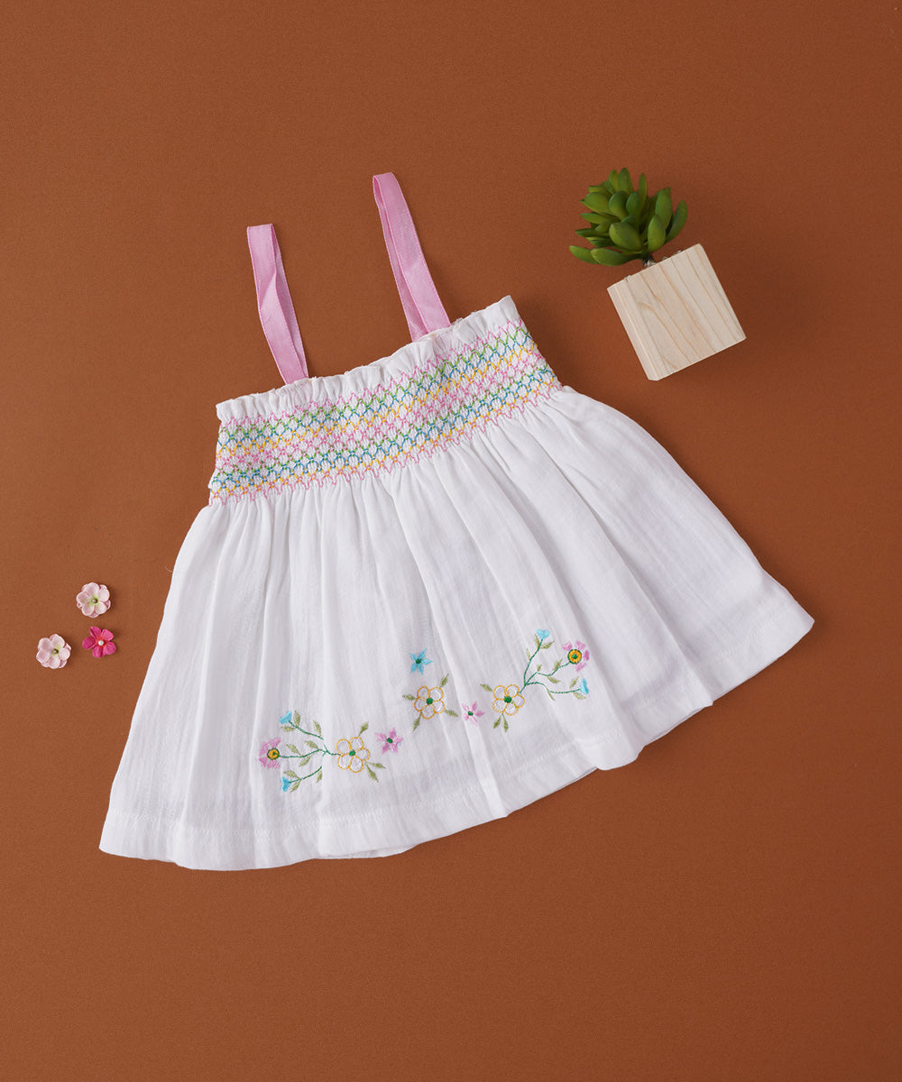 🌸 White Muslin Baby Frock with Hand Embroidery & Pink Smocking Straps