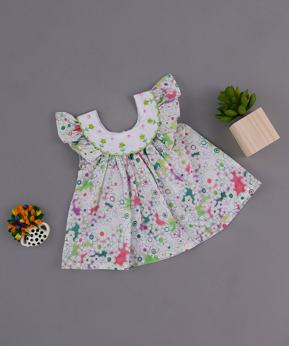 White Floral Baby Frock with Embroidered Yoke and Ruffle Sleeves