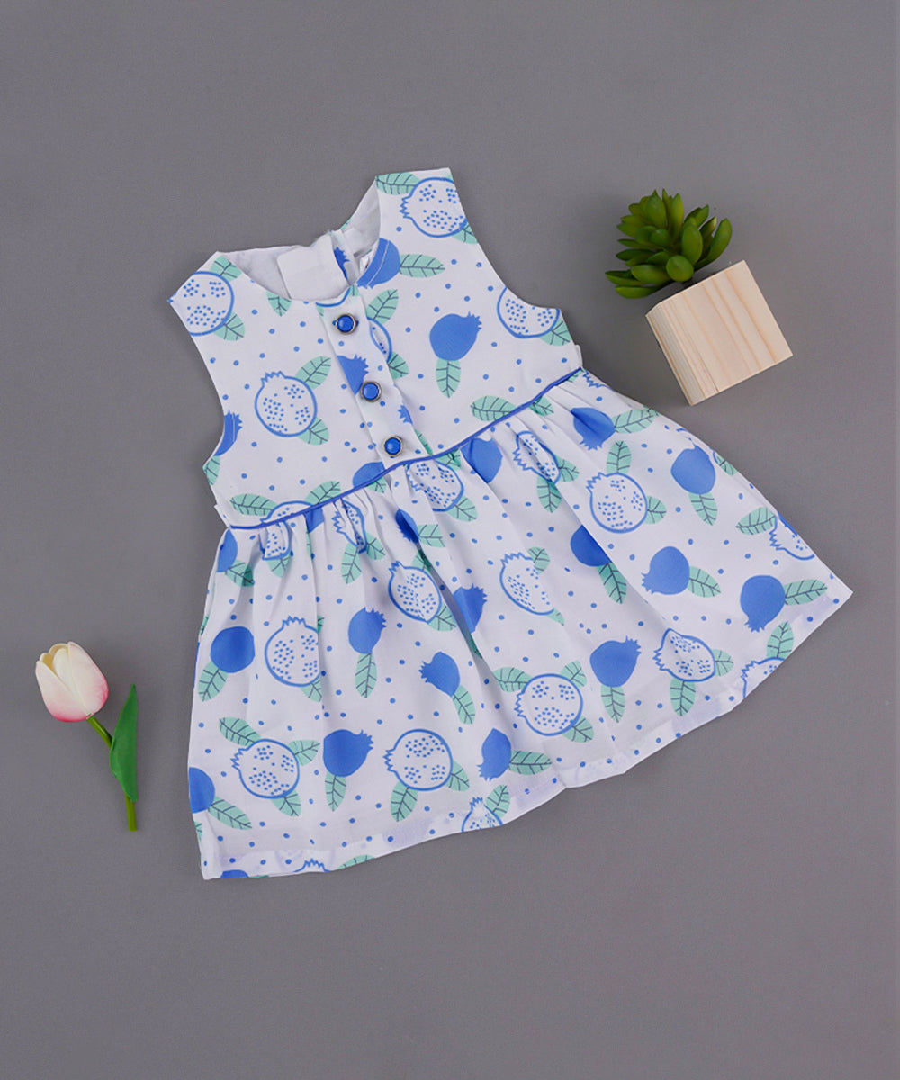 White Sleeveless Baby Frock with Blue Pomegranate Print & Button Accents